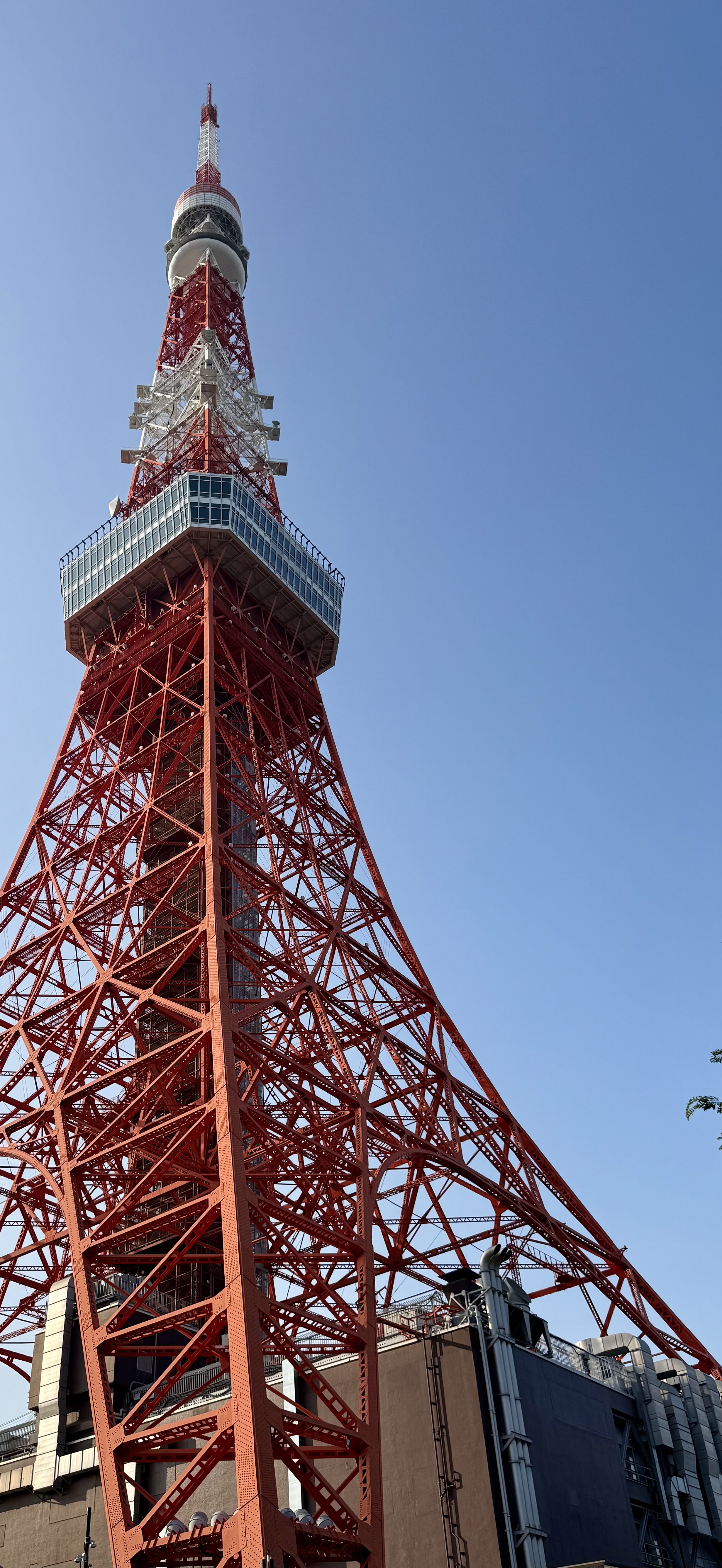 Another half of an image wall in the Yokohama Cup Noodle Museum and Factory of historic legends with Never Give Up written across the top